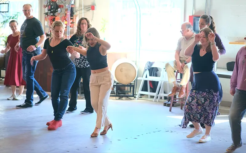 people dancing at salsa social march 2025